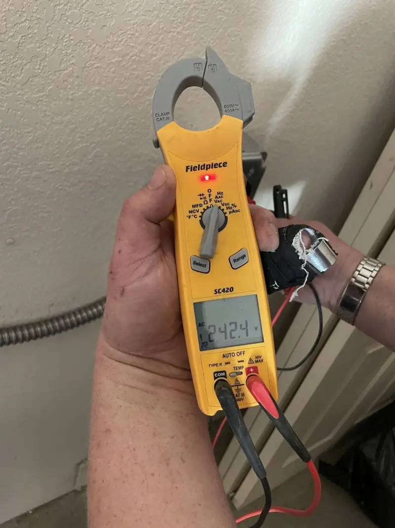 Voltage testing with clamp meter during Recessed Lighting Installation in Cedartown